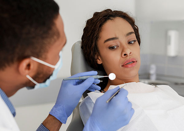 patient looking at the dental tools anxiously