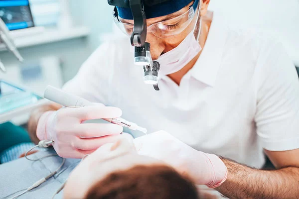 dentist performing treatment on a patient