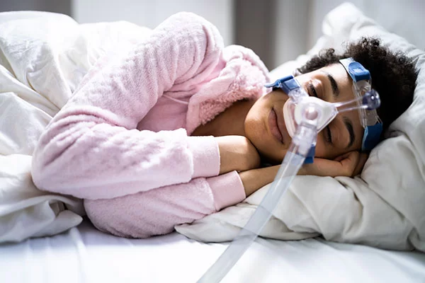 woman with a cpap mask